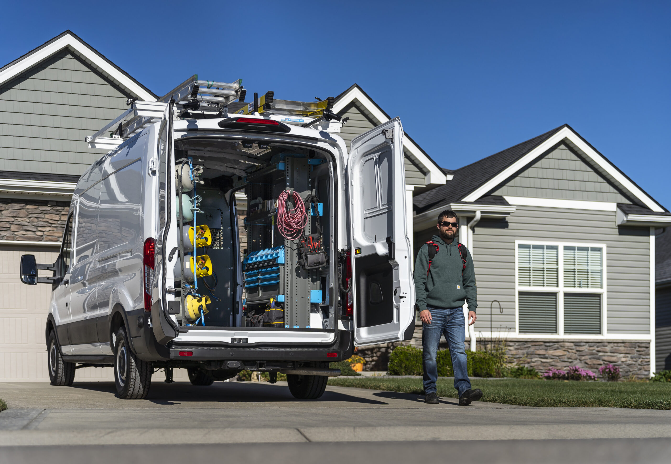 USA Plumbing and Trenchless technician arriving at home with fully stocked service van